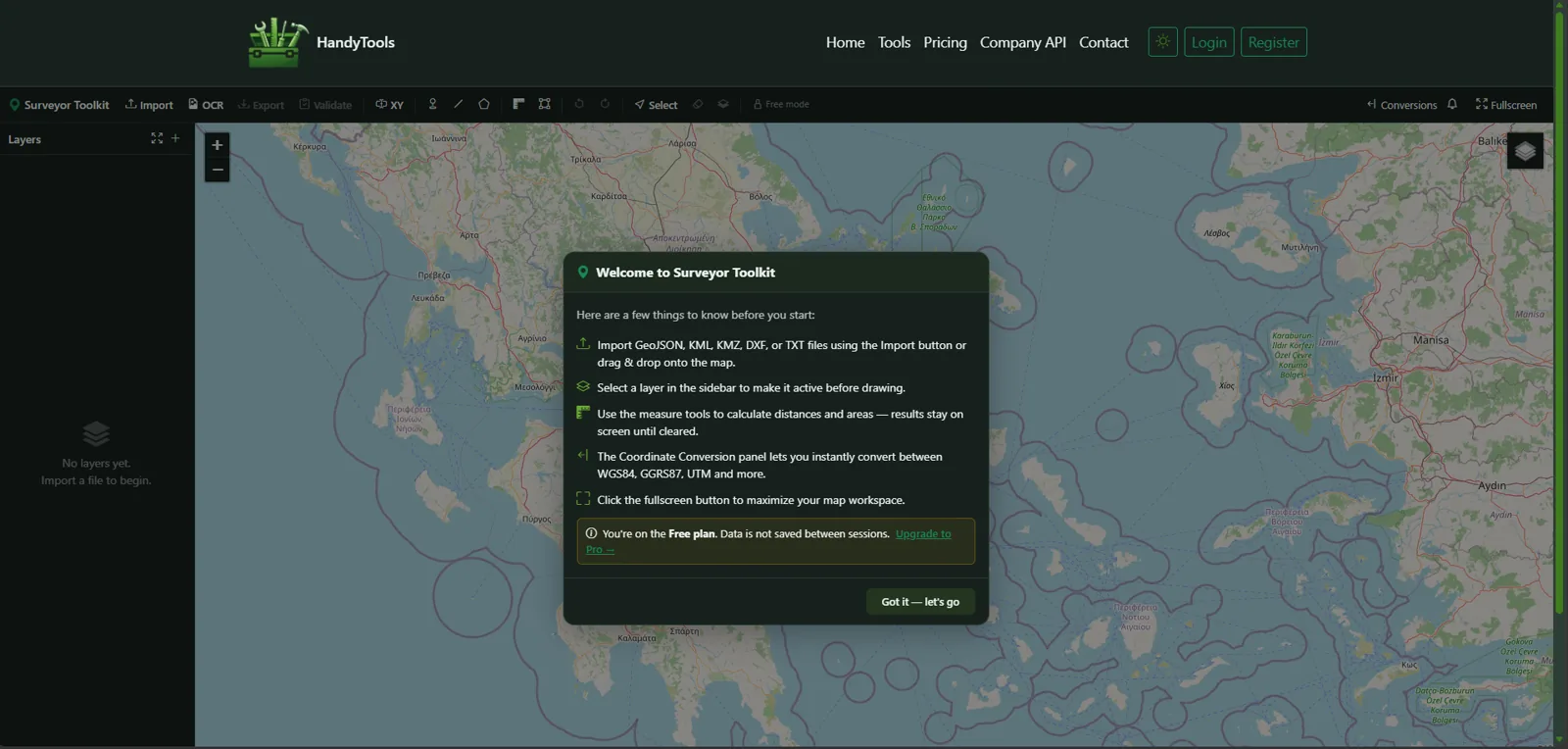 Surveyor Toolkit map workspace with a layers sidebar, drawing and measurement toolbar, and an onboarding dialog explaining GeoJSON, KML, KMZ and DXF import